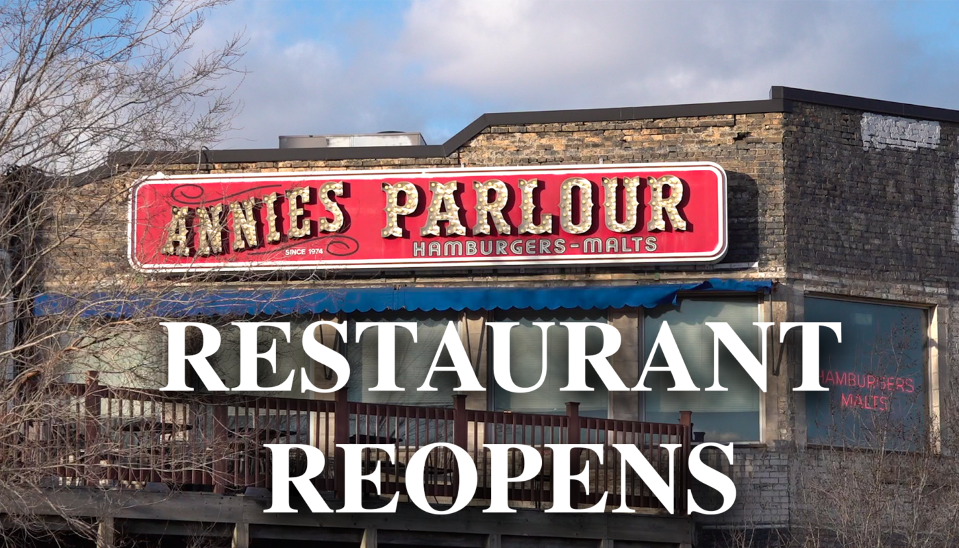 Annie's Parlour restaurant outdoor sign with text that says "restaurant reopens" on top of the picture