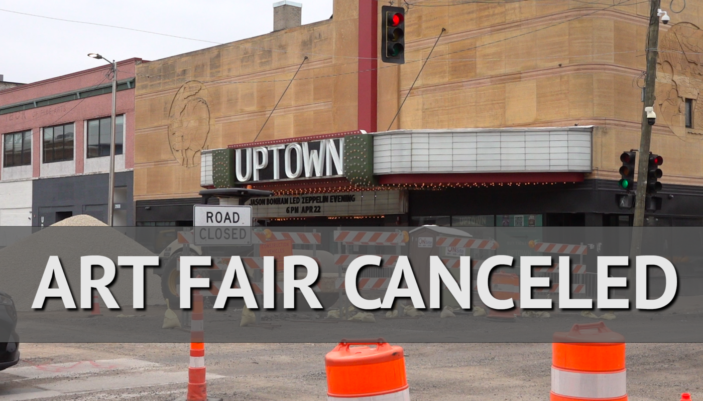 Image of the Uptown Theater with road construction on Hennepin Avenue with text overlaid that reads "art fair canceled"