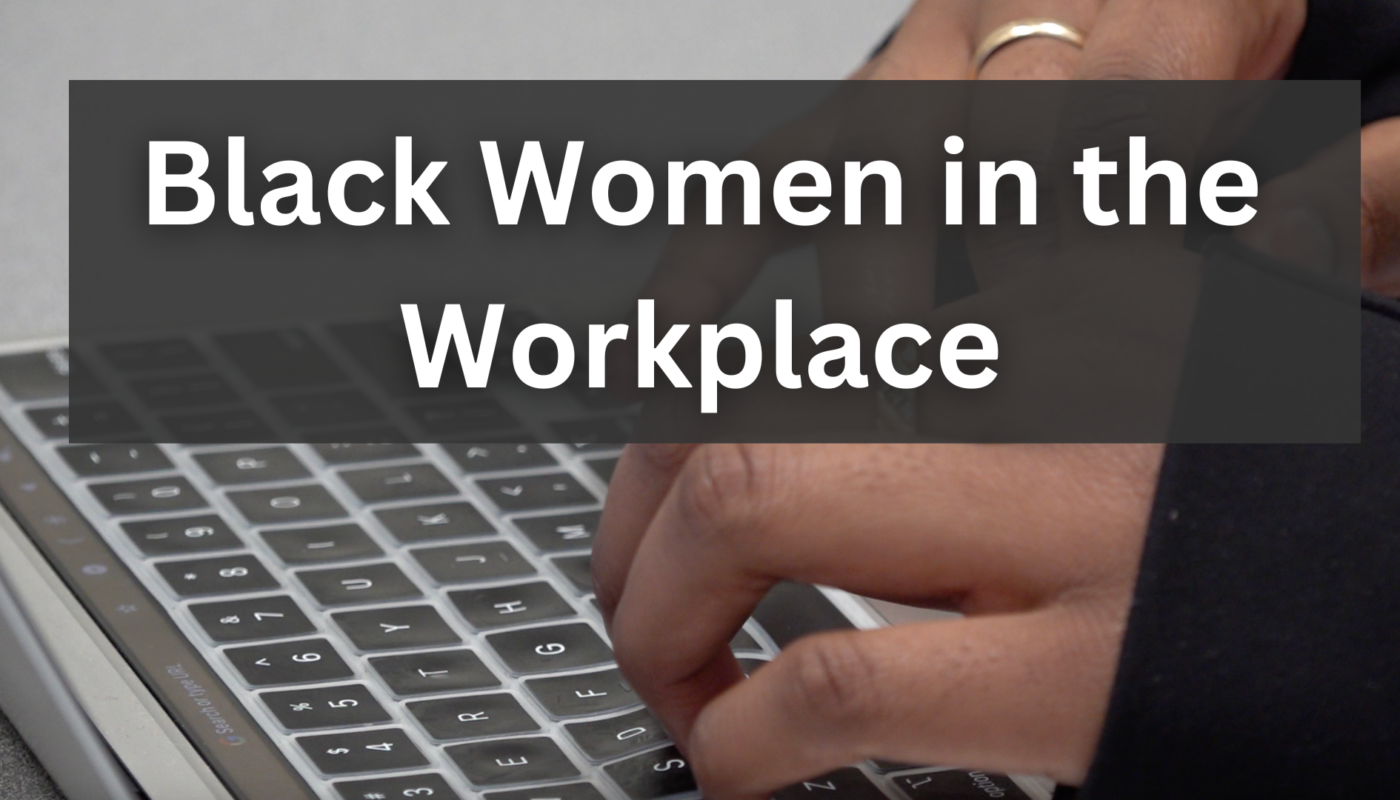 Woman's hands typing on a laptop. The words Black women in the workplace overlay the image.