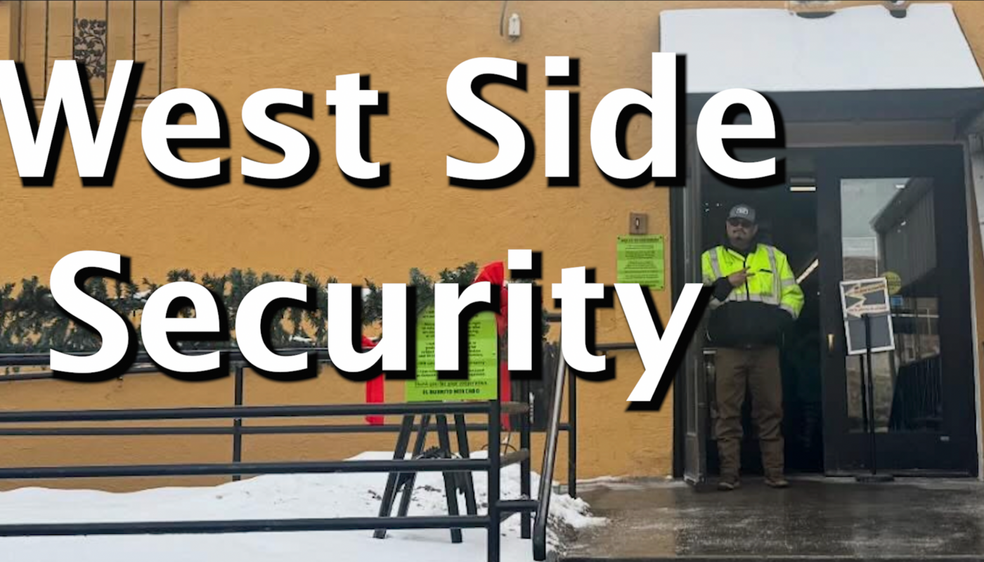 Neighborhood security guard holds up a peace sign in front of El Burrito, a local restaurant in the West Side.